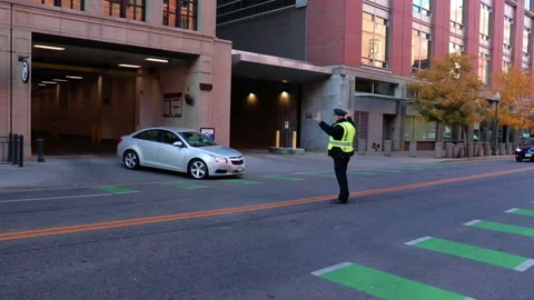 Cop directing traffic Denver Stock Footage 219889018
