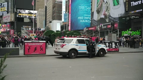A Cop Gets Out Of His Car In Times Square Stock Footage 233765603