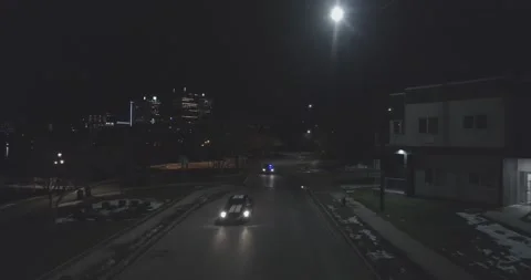 Cop ghost car chases a Ford Mustang - Tracking - Night Stock Footage 146471677