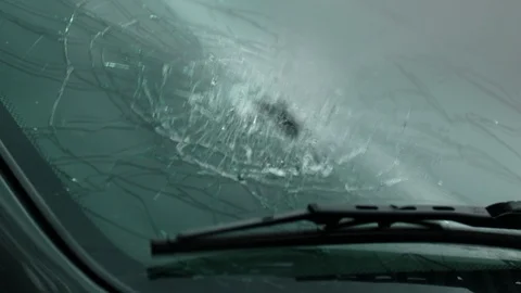 Cop shoots through the windshield of the car. Slow Motion 4K UHD. Video stock 107333830
