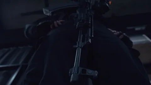 The cop is standing with a gun Video stock 120608964