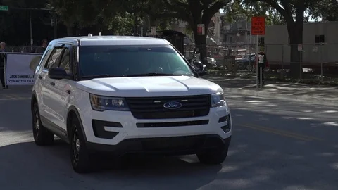 Cop van driving slowly with lights Stock Footage 128445856