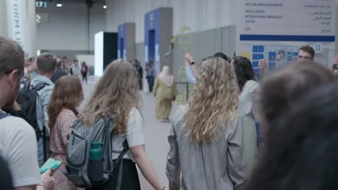 COP28, Dubai: A chain of activists hold hands and raise arms Stock Footage 289201208