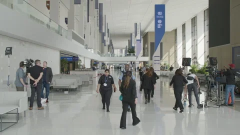 COP28, Dubai: Journalists filming inside Expo City hall 動画素材 289728079