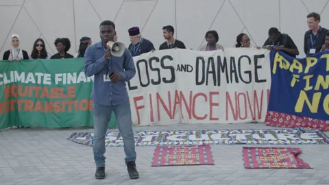 COP28, Dubai: A protester makes a speech for climate justice Stock Footage 288471242