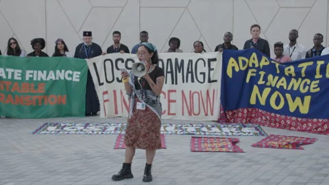 COP28, Dubai: A protester makes a speech for climate justice Stock Footage 288471564