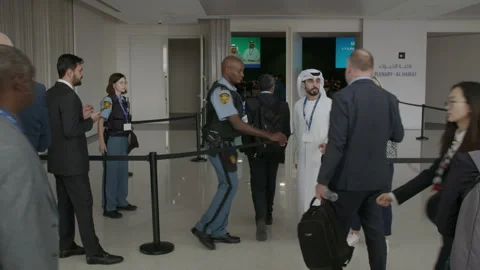COP28, Dubai: Security guards at the private entrance to the plenary hall 動画素材 289731708