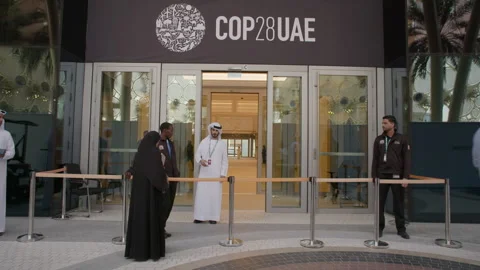 COP28, Dubai: Security guards watch over a private entrance Stock Footage 289553889