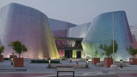 COP28, Dubai: View on modern building with colorful lighting, at dusk Stock Footage 289634860