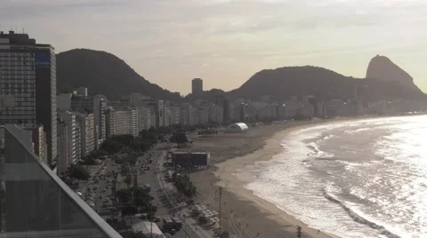 Copacabana Beachfront with Hotels, Waves and Sugarloaf Mountain Stock Footage 64978704
