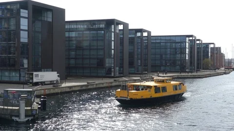 COPENHAGEN, DENMARK - MARCH 2019: The water bus floats along the canal of the Stockbeeldmateriaal 107988198
