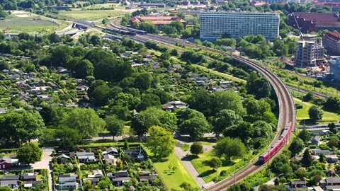 Copenhagen local train driving through area of vacation homes Video stock 242595183