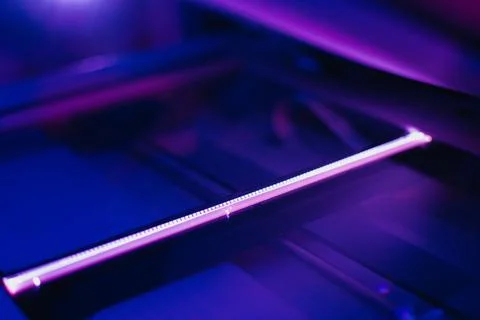 Copier scanner with a bright light inside. Office hazards Stock Photos