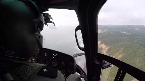 Copilot of a helicopter flying over the coast line of Ecuador Video stock 62832699