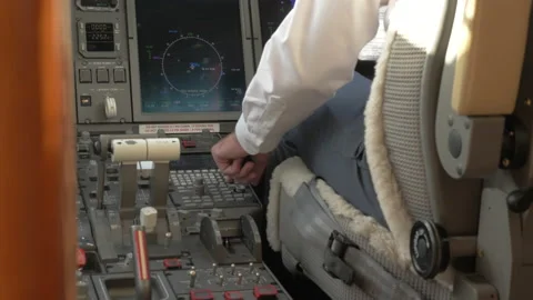 Copilot Pressing Buttons in a Cockpit of a Private Jet Stock Footage 208753857