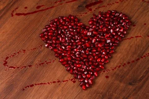 Copmposition heart pomegranate Stock Photos