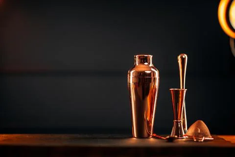 Copper bar tools set with shaker on wooden table Stock Photos