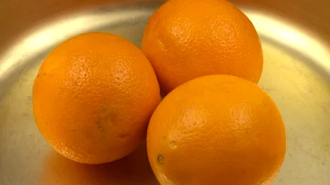 Copper basin for jam, ripe whole oranges, background Stock Footage 171085699