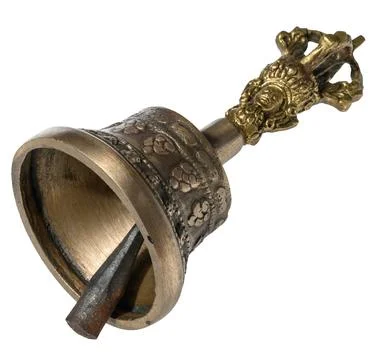 Copper bell on isolated background, close up.. Fotos de archivo