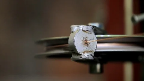 A copper cable is passed through a narrow hole Stock Footage 76951014