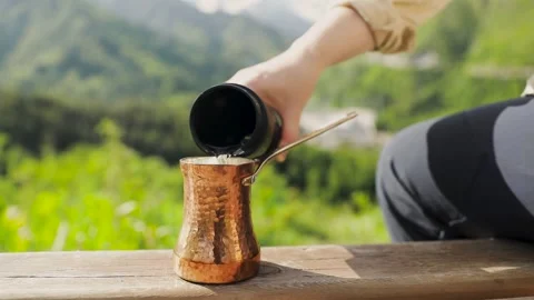 Copper Cezve for coffee in the mountains Stock-Footage 244053489