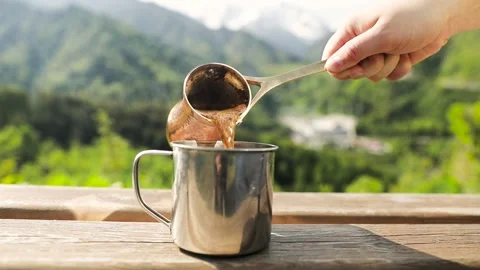 Copper Cezve with coffee in the mountains Stock Footage 244054602