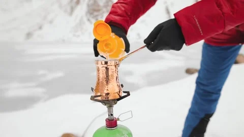 Copper Cezve for coffee in winter mountains Stock-Footage 163919782