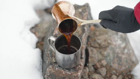 Copper Cezve for coffee in winter mountains Stock Footage 163919992