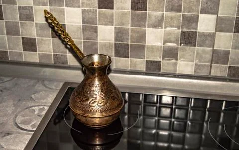 Copper cezve for making coffee to kitchen Stock Photos