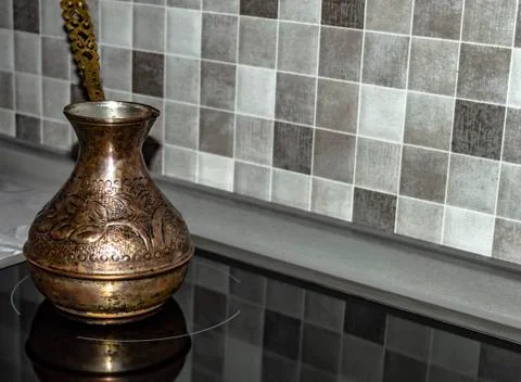 Copper cezve for making coffee to kitchen Foto stock