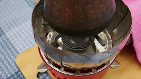 Copper Cezve Turkish Coffee Pot Heating on Portable Camping Stove Stock Footage 341995281