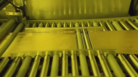 Copper circuit board panels moving on roller conveyor Video stock 348171146