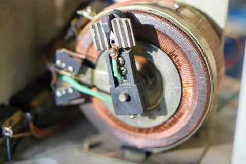 Copper coil component inside an automatic voltage regulator or servo stabilizer Stock Photos