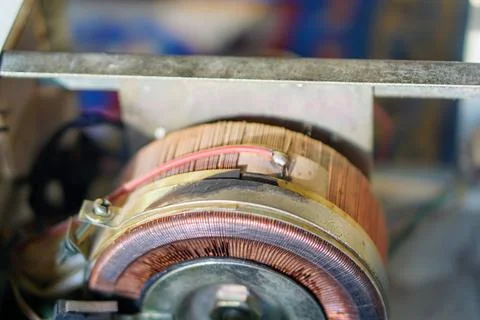 Copper coil component inside an automatic voltage regulator or servo stabilizer Stock Photos