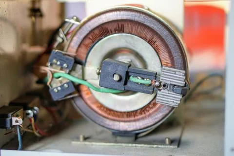 Copper coil component inside an automatic voltage regulator or servo stabilizer Stock Photos