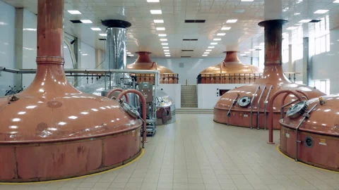 Copper containers store lots of beer at a modern brewery factory. Stock Footage 105424052