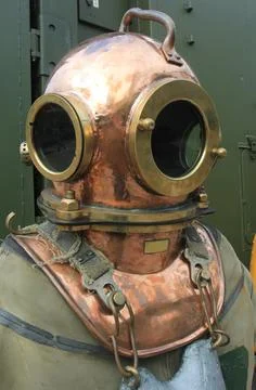 Copper diving helmet with screw down porthole Stock Photos