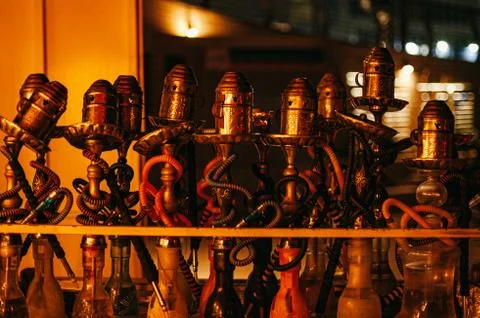 Copper hookahs in the light of the evening lamp Stock Photos