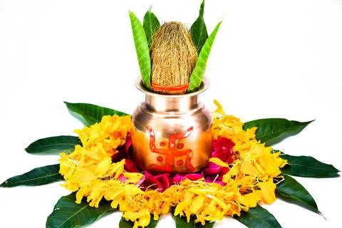Copper kalash with coconut, mango leaf, and marigold flower Stock Photos