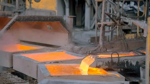 Copper ore processing plant pouring molten ore Stock Photos