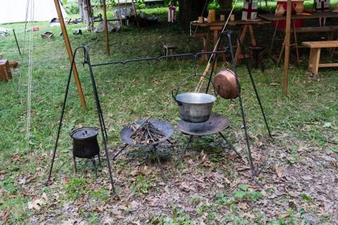 Copper pan on fire with soup during a Middle Ages historic reenactment Stock Photos