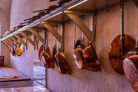 Copper pans with their lids at Christianborg Palace. Copenhagen Denmark. Stock Photos
