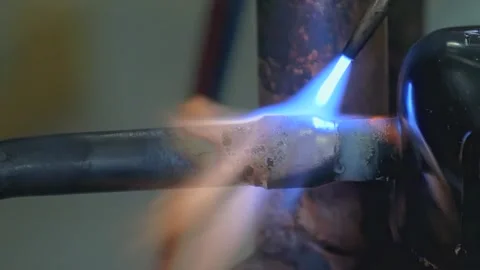 Copper Pipe Brazing Process With Intense Blue Flame During Afternoon Workshop Stock Footage 340486612