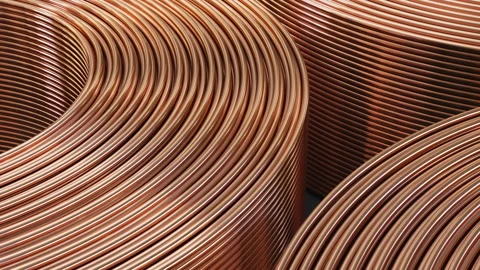 Copper pipes close-up. Coils with tubes in warehouse. Stock Footage