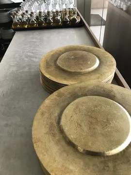 Copper plates on the table Stock Photos