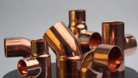 Copper plumbing fitting adapter copper pipe accessories spinning around 4k Stock Footage 226843759