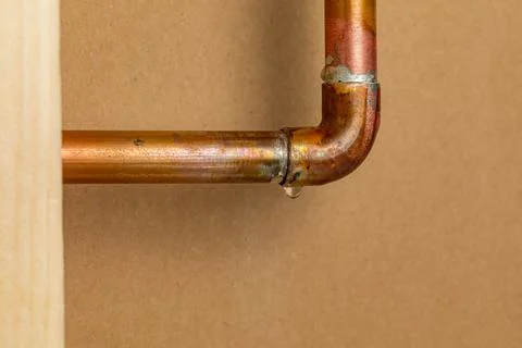 Copper plumbing pipe leaking Fotos de archivo