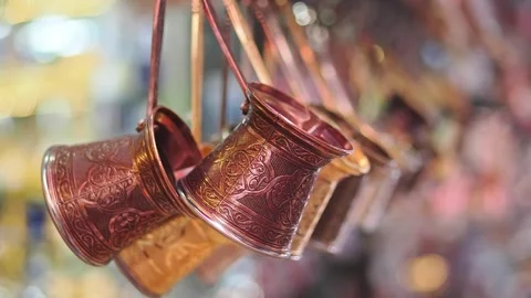 Copper pots hanging in a market display some local craftsmanship Stock Footage 346579147