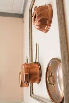 Copper pots on the wall Stock Photos