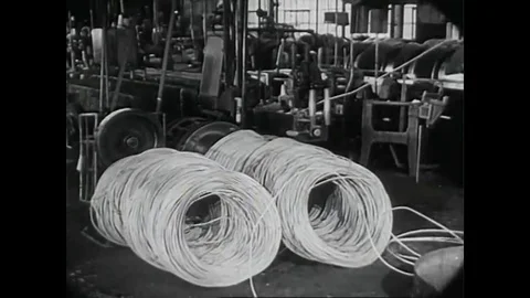 Copper is processed and coils are produced at an Auto-lite plant in the 1940s. Video stock 141577275